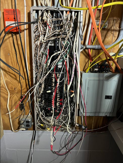 Dangerous electrical breaker panel.